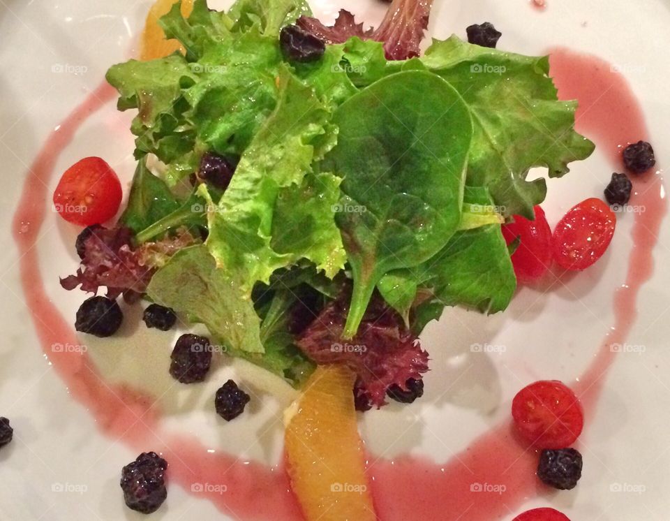 I heart salad. Salad with dressing drizzled in the shape of a heart