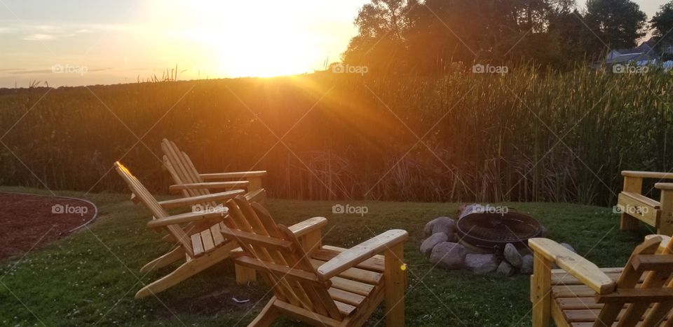 Sunset Adirondack Chairs around the firepit