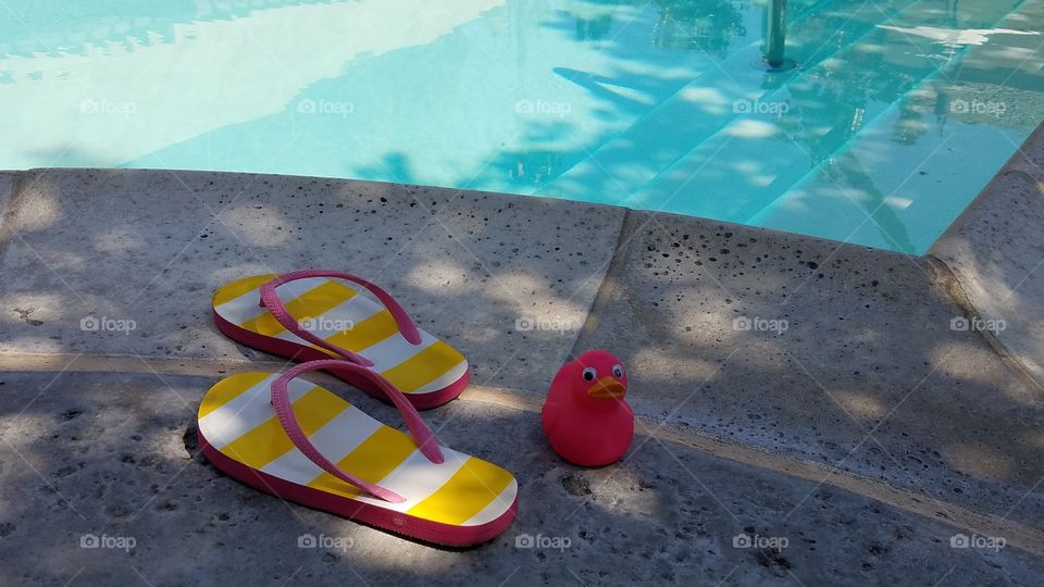 Pink duck and flip flops