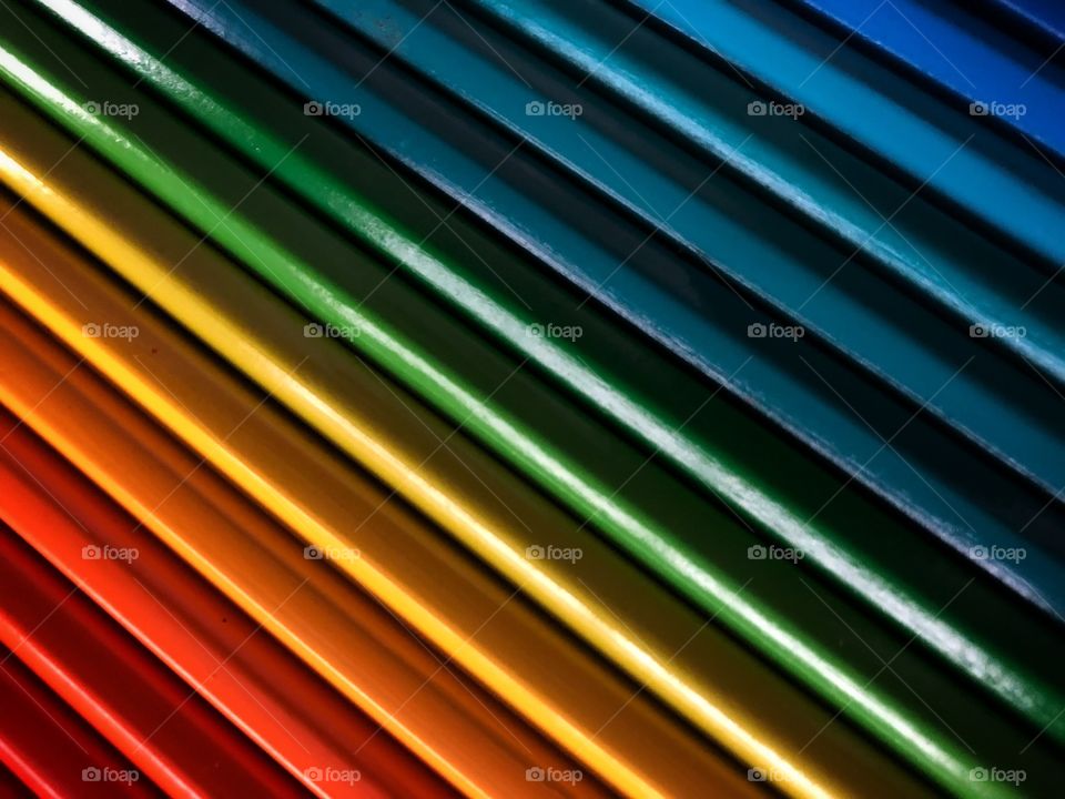 Colored pencils, side by side in a chromatic scale... From dark red to Dark Blue. An explosion of colors in a bright and happy effect, and texture.