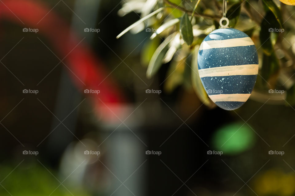 Easter egg on tree. Easter egg hanging on tree as decoration