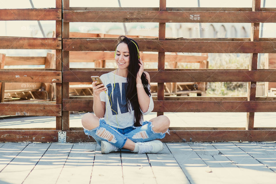 Young girl is listening to music