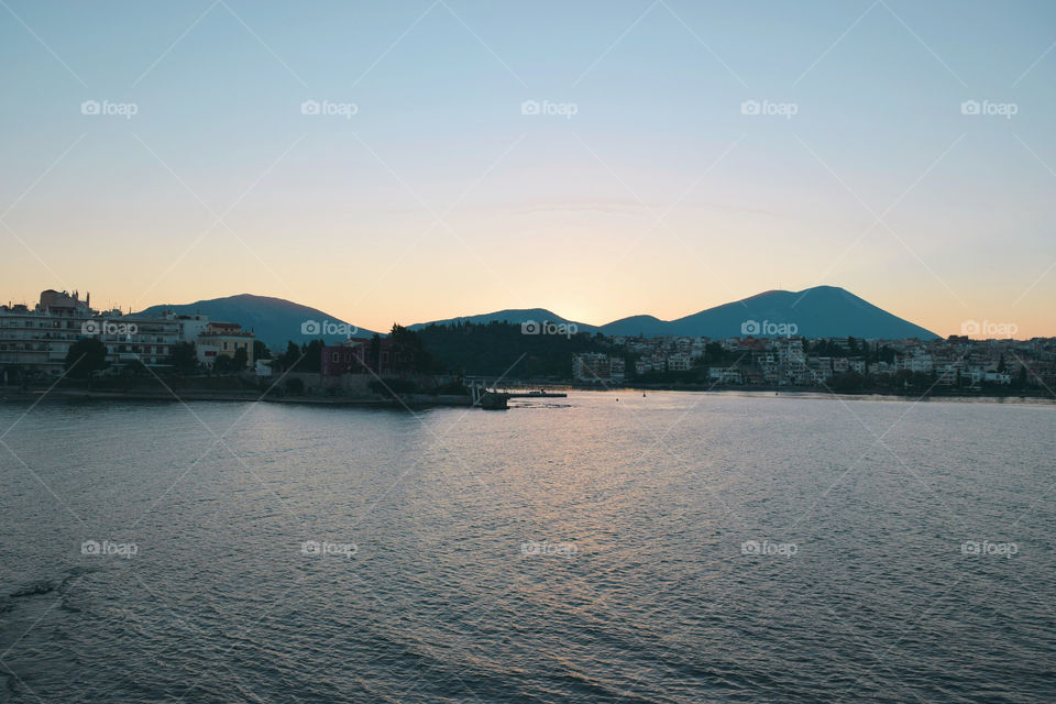 Scenic view of sea near cityscape