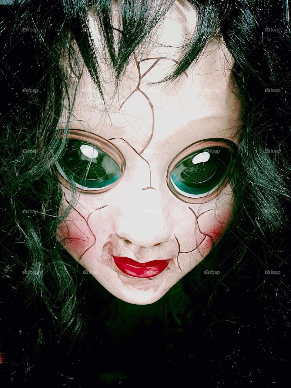 Scary doll with camera lens eyes 