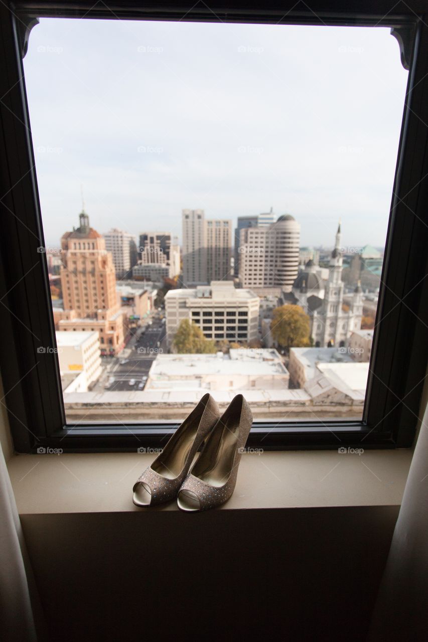Wedding shoes on window sill in Sacramento downtown 