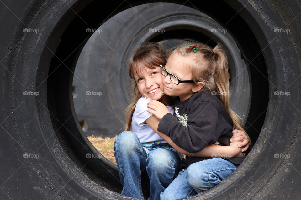 Sisters lovingly embracing