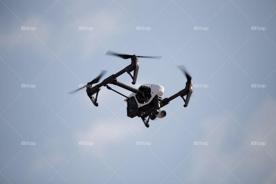 Dji inspire one pro drone in the working stage on the sky