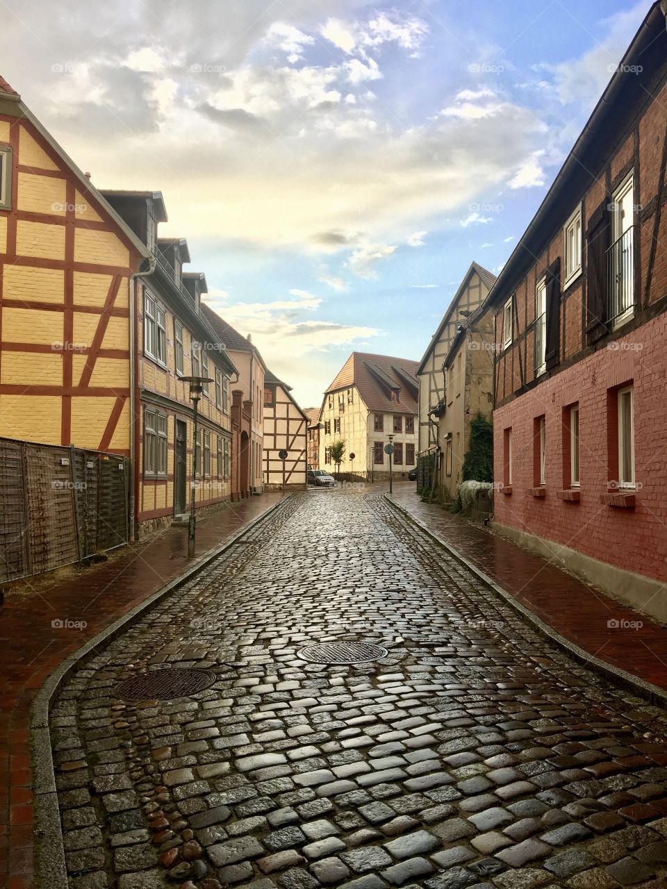 An empty cobbled street of a European city