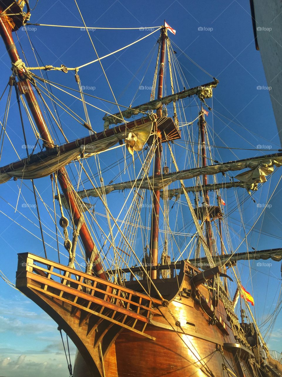 Out on the blue. A gorgeous ship sitting in a marina