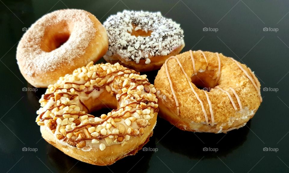Selection of sweet doughnuts with different toppings