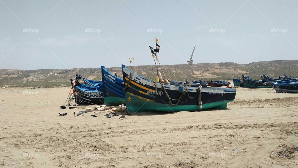 Beautiful boats near the beach on sand