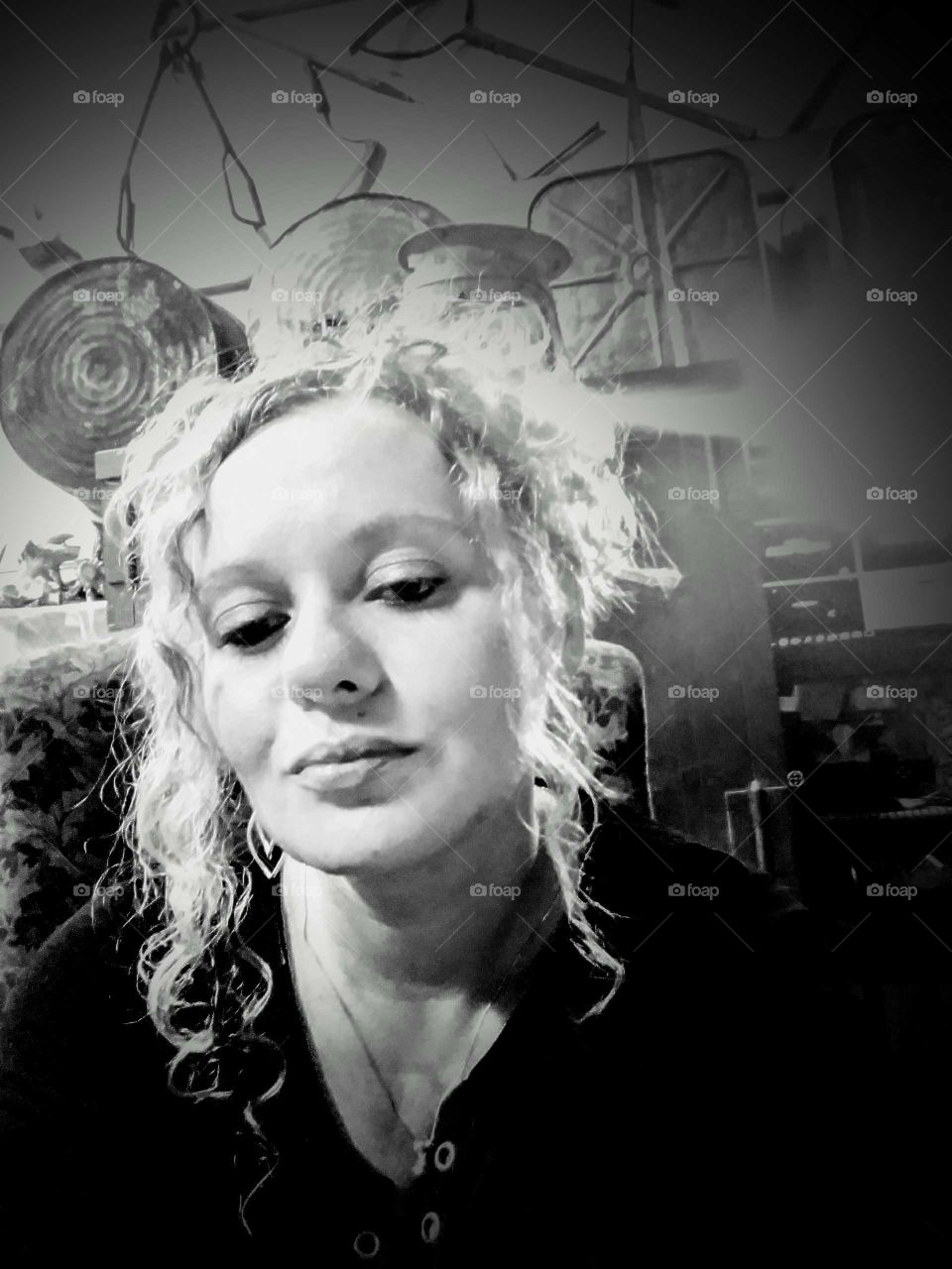 Beautiful woman with curly hair looking confident to be who she is.