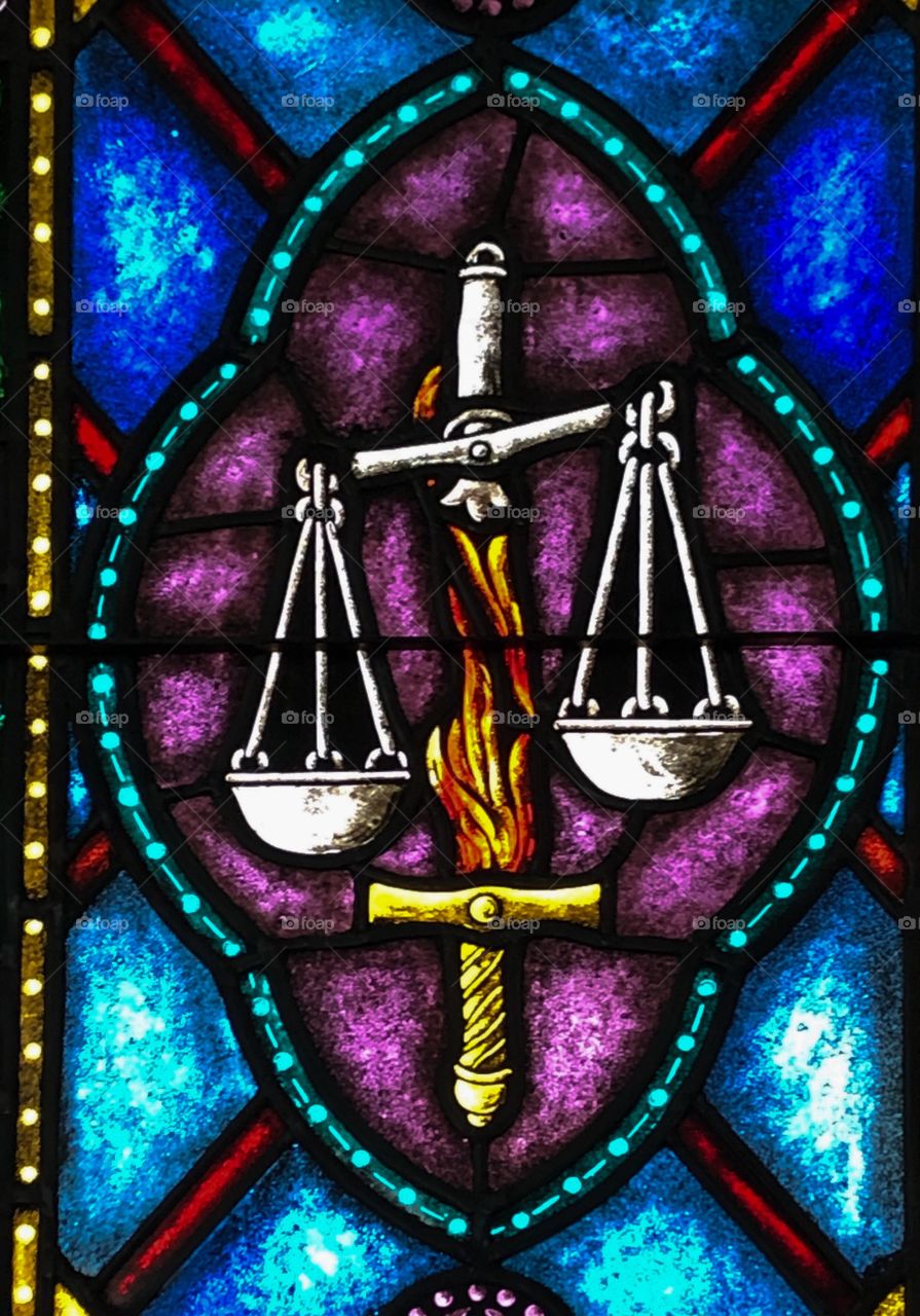 Stained Glass image of the Flaming Sword of Justice 