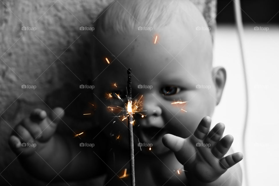 A photo of old doll is a model of a human being, often used as a toy for children that decorate the place with fireworks. 