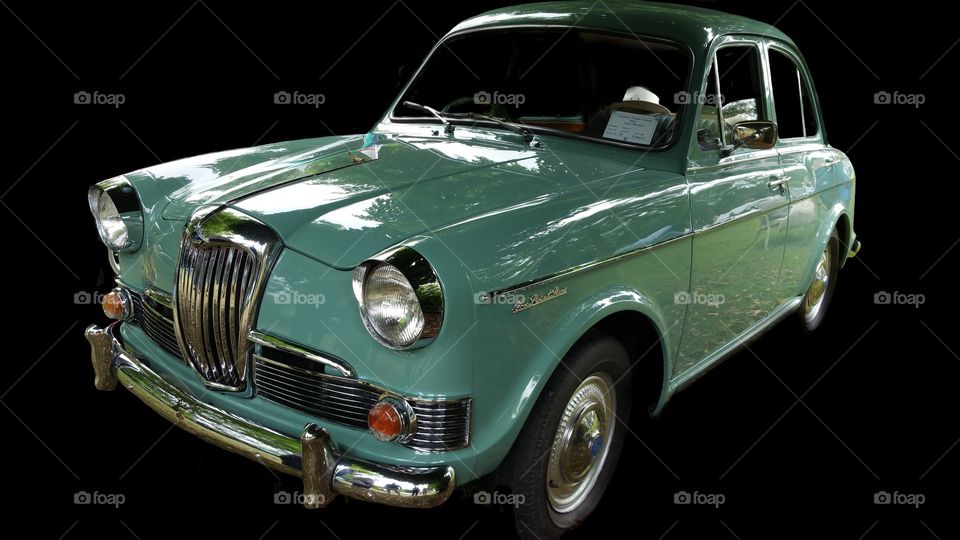 1962 vintage Riley isolated on black

Successor	Riley Kestrel/Wolseley 1100/1300
The Riley One-Point-Five and similar Wolseley 1500 are automobiles which were produced by Riley and Wolseley respectively from 1957 to 1965. They utilised the Morris Minor floorpan, suspension and steering but were fitted with the larger 1489 cc B-Series engine and MG Magnette gearbox. The two models were differentiated by nearly 20 hp (15 kW), the Riley having twin SU carburettors giving it the most power at 68 hp (50 kW). The Wolseley was released in April 1957 and the Riley was launched in November, directly after the 1957 London Motor Show.

The Series II was released in May 1960. The most notable external difference was the hidden boot and bonnet hinges. Interior storage was improved with the fitting of a full width parcel shelf directly beneath the fascia.

The Series III was introduced in October 1961, featuring revisions to the grille and rear lights.

In October 1962 the cars received the more robust crank, bearing and other details of the larger 1,622 cc unit now being fitted in the Austin Cambridge and its "Farina" styled clones. Unlike the Farina models, however, the Wolseley 1500 and Riley One-Point-Five retained the 1,489 cc engine size with which they had been launched back in 1957.

Production ended in 1965 with 39,568 Rileys and 103,394 Wolseleys made