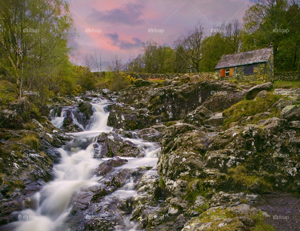 Near Ashness Bridge. Hut and river at twilight 