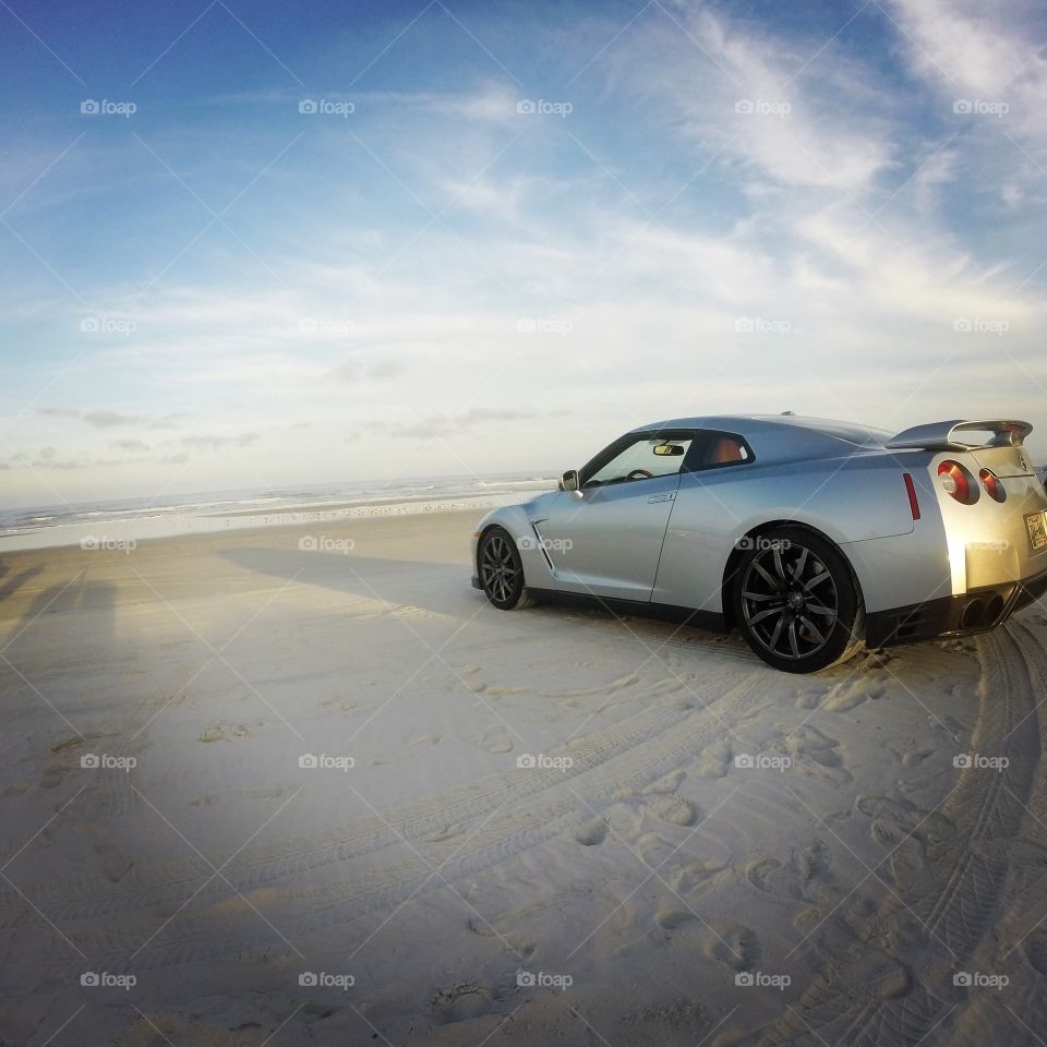 The calm before the storm. . Nissan GTR on the beaches of Florida. 