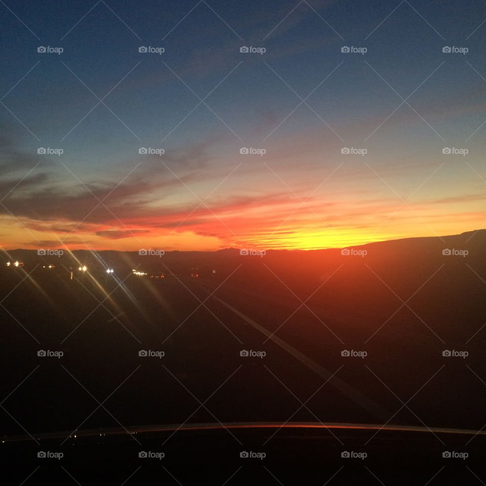 Driving Sunset. A sunset view along a highway