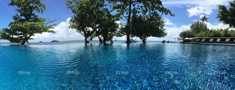 Panoramic view of infinity pool and resort