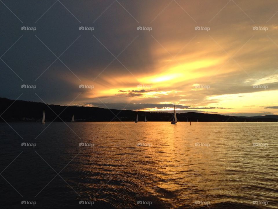 water sunset setting sun sail boat by aja064