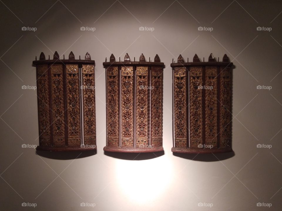 Golden wooden carved northern Thai style for wall decoration.