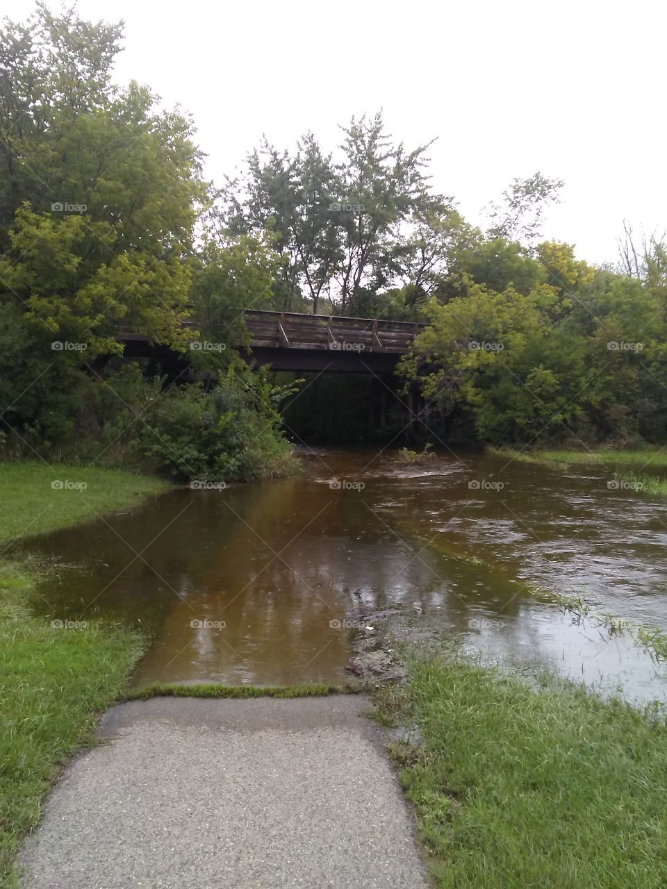 Flooding under an old railroad trestle now the Eisenbahn State Trail in Kewaskum,Wisconsin.