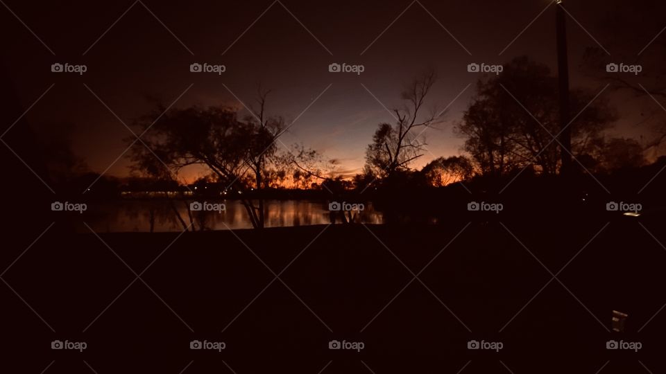 And The Grand Finally is here the Night has taken over the Evening Sky. Beautiful Night Colors Refections of the lake water. The Composure silhouette of the Western shoreline. 