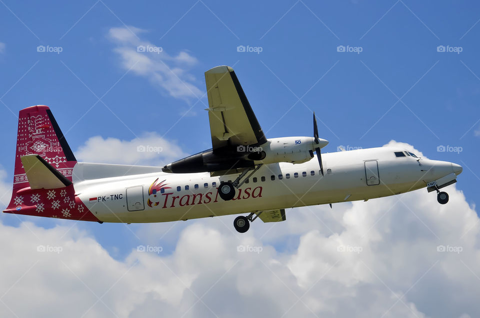 Plane atr trans nusa taking off from an airport....