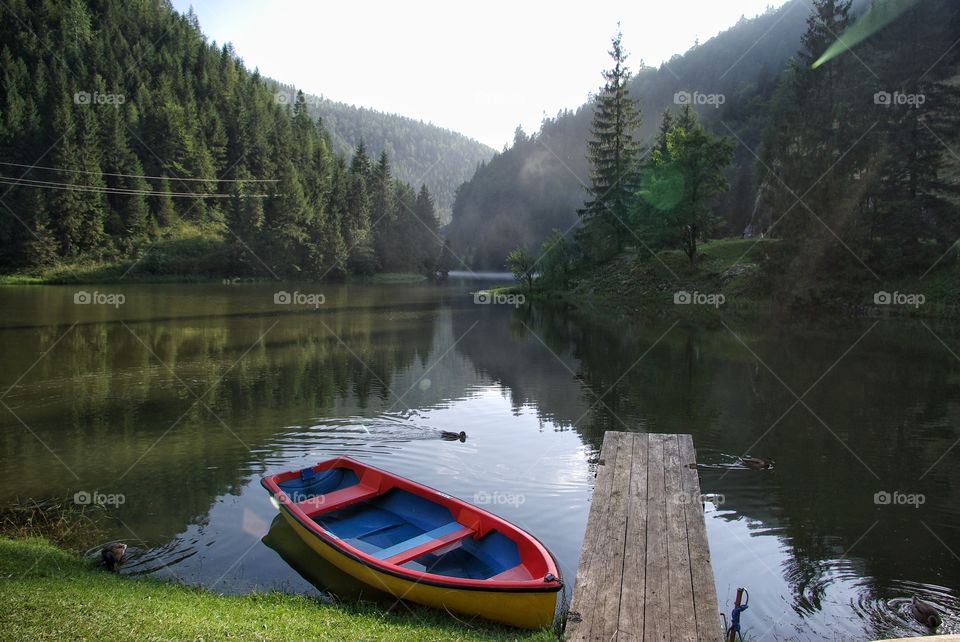 Boat moored on lake