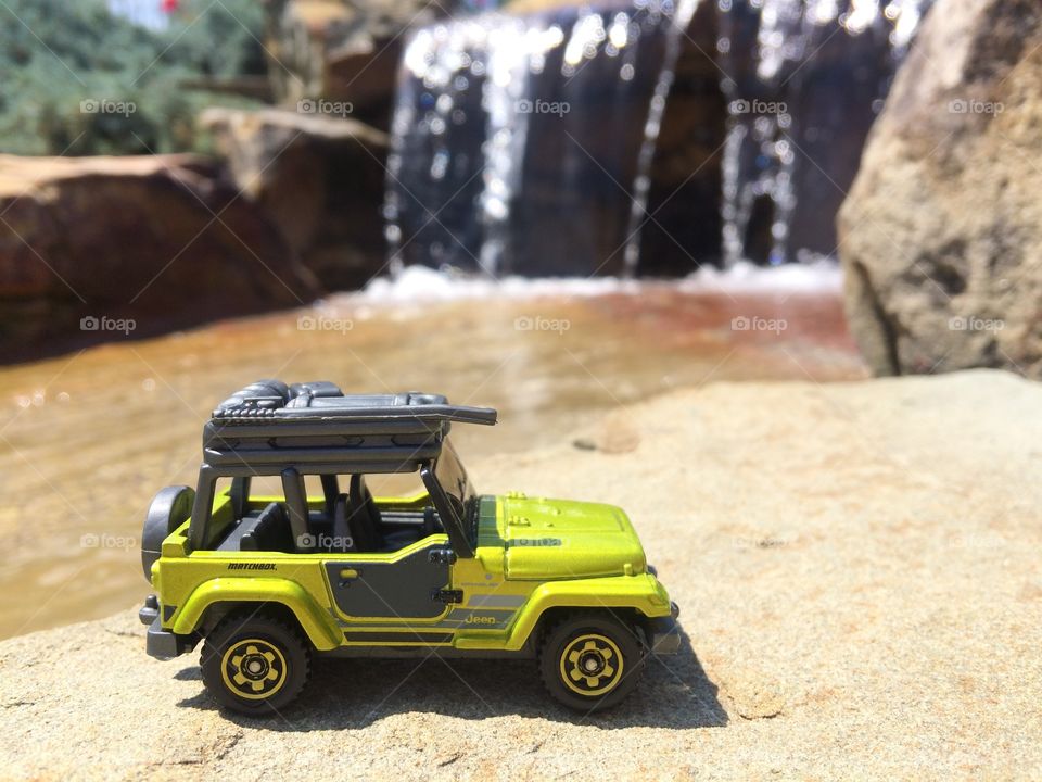 Jeep by a waterfall 