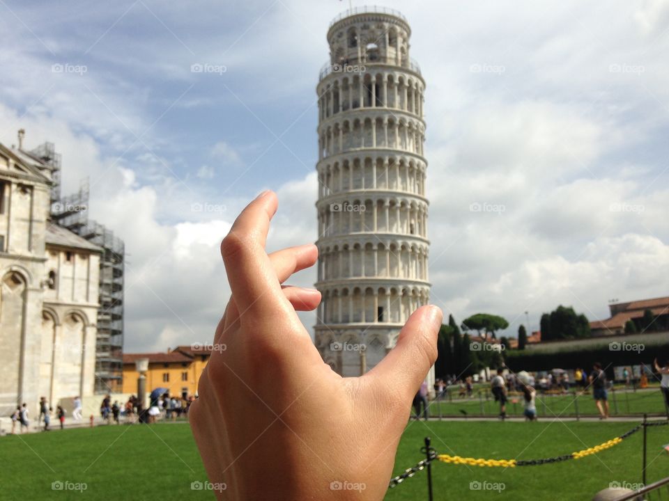 Pisa tower in a hand 