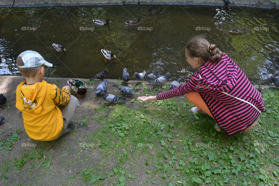 children on a urban city river