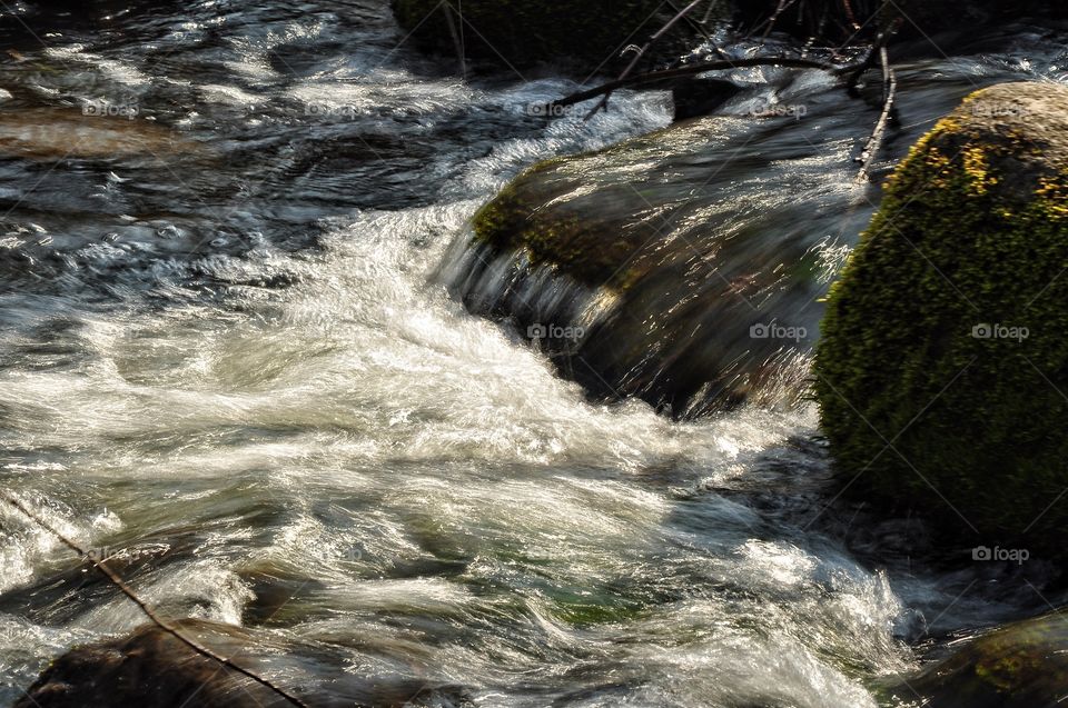 waterfall and river in the spring park in Poland