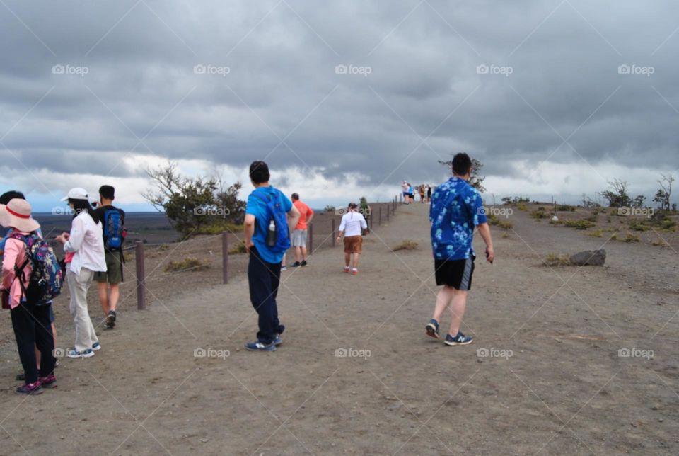 People going up a mountain to a look out point 