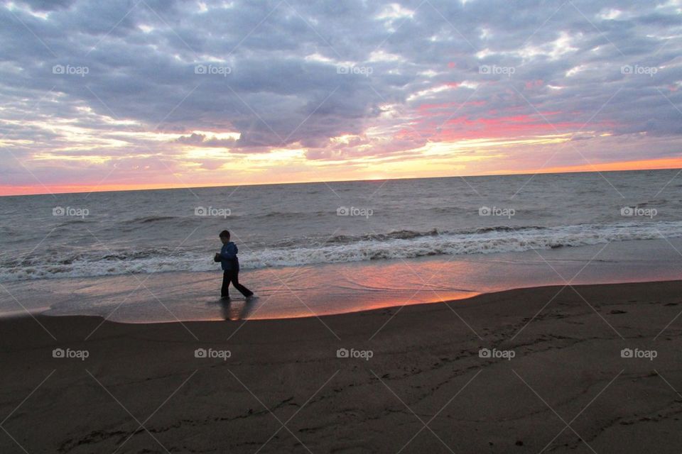 Boy Walking in Sunset