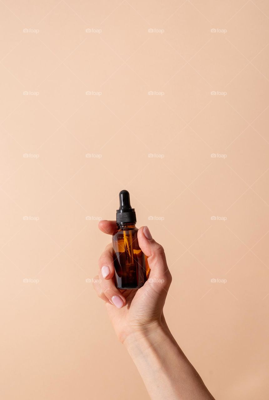 woman hand holding beauty products