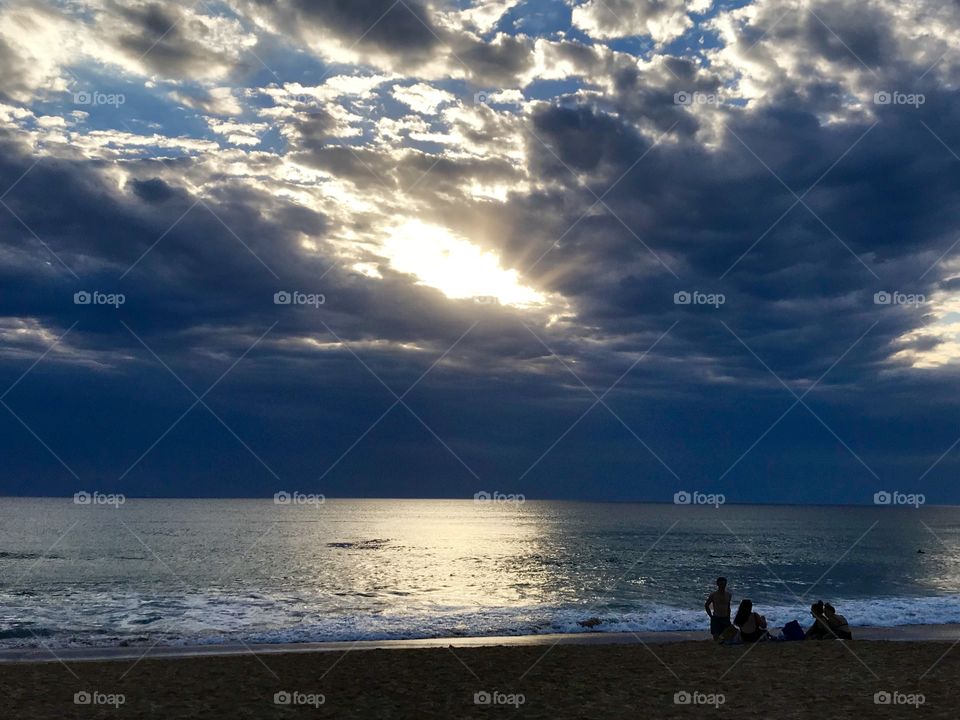 Watching the storm rolling in from the beach