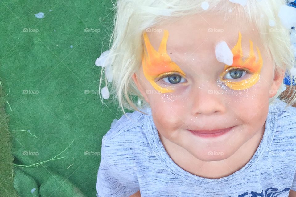 Cute boy with face paint