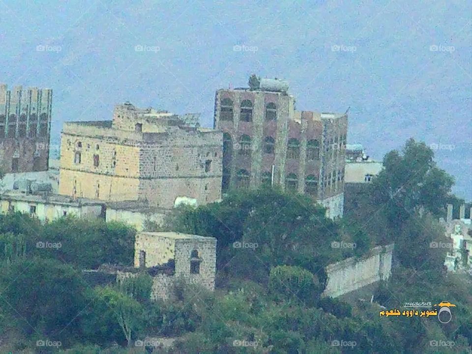 A stunning view of green mountains covered in fog in Yemen