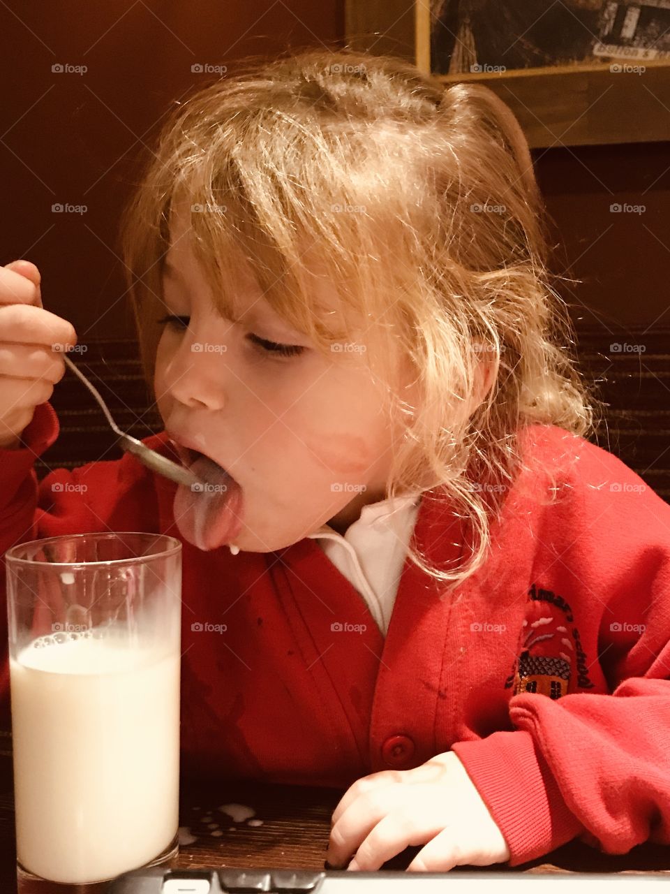 Little girl loves milk