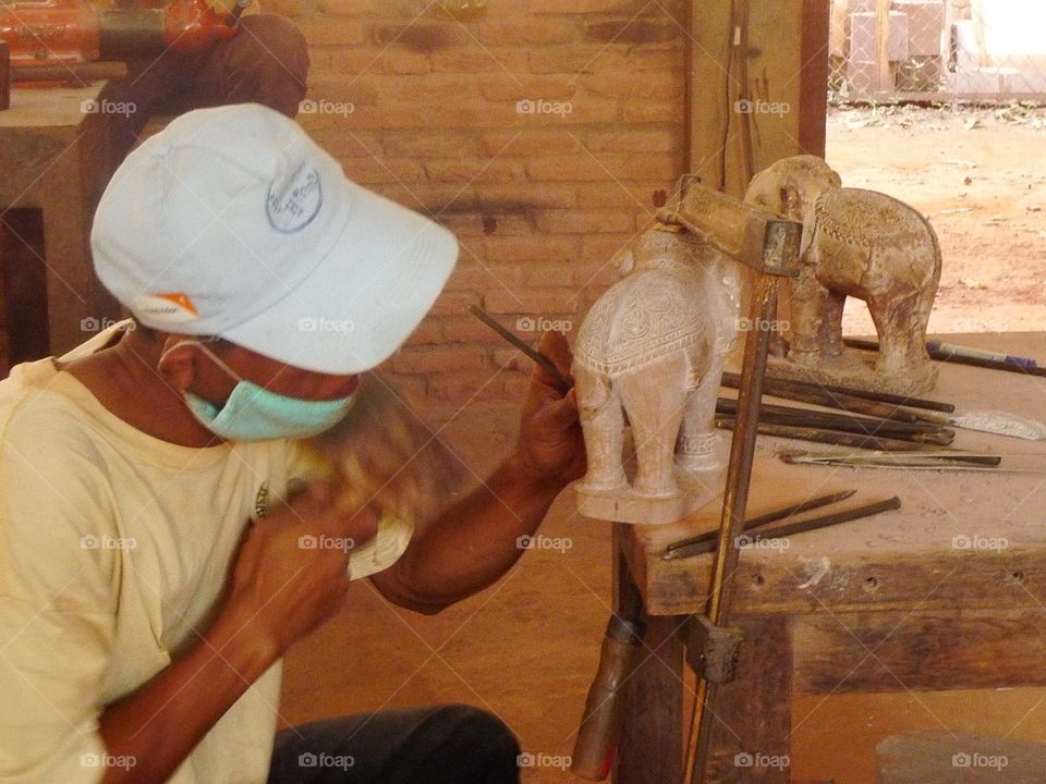 sculpting an elephant in Cambodia