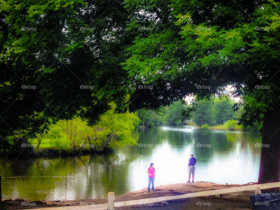 Fishing lake. People fishing