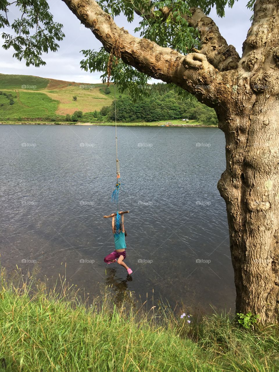 Girl on rope swing