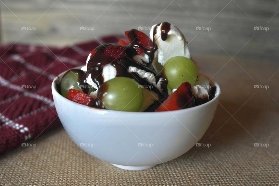 Ice cream with chocolate and fruits 