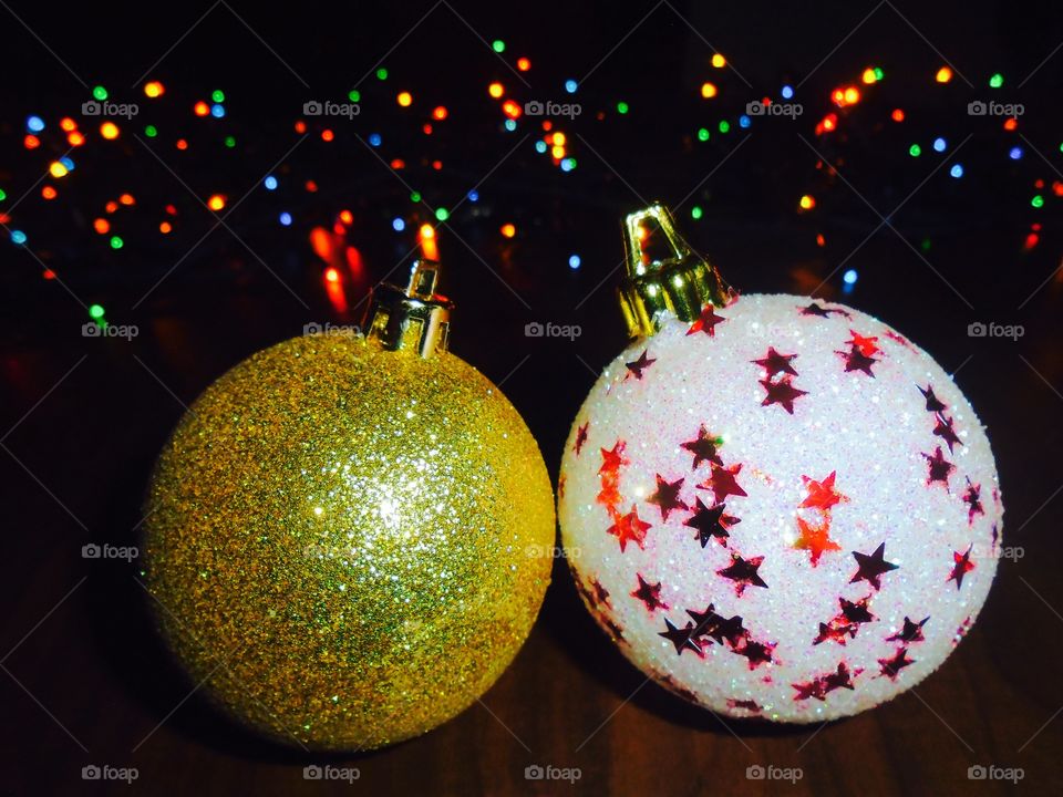 Christmas globes with lights in the background