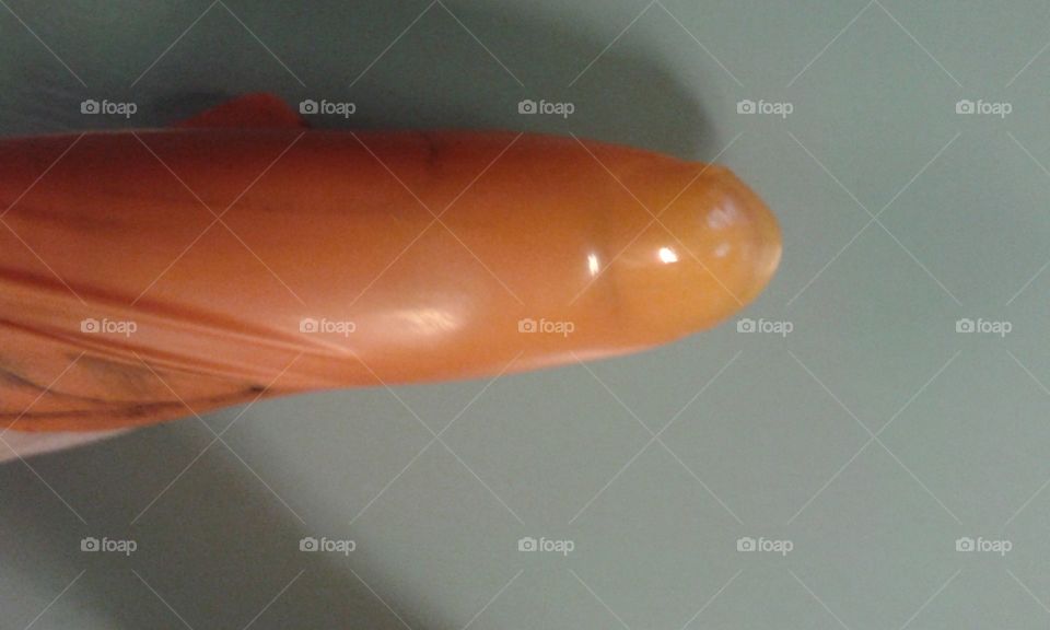 playing with popped balloon pieces at work