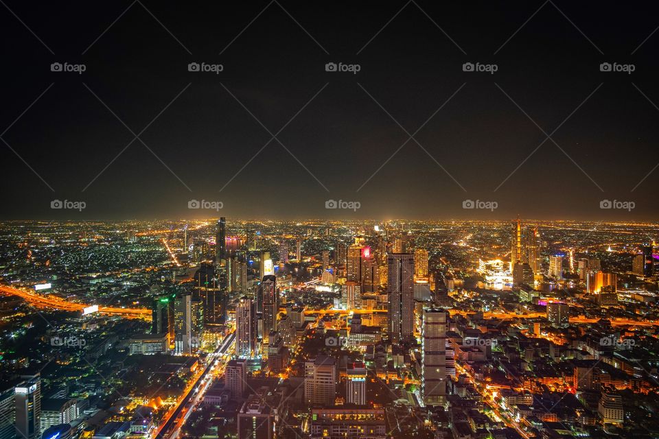 Night light scene of skyscraper in capital city , Bangkok Thailand 