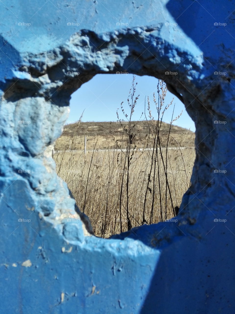 Hole in the wall of blue.