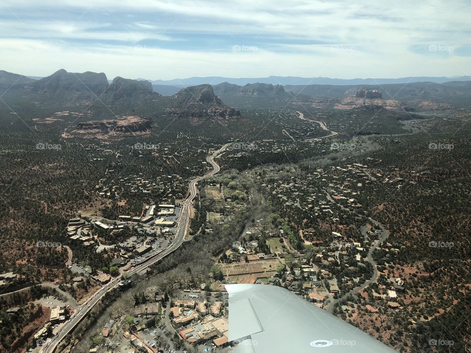 View of a road running through a city from an airplane flying above Arizona 