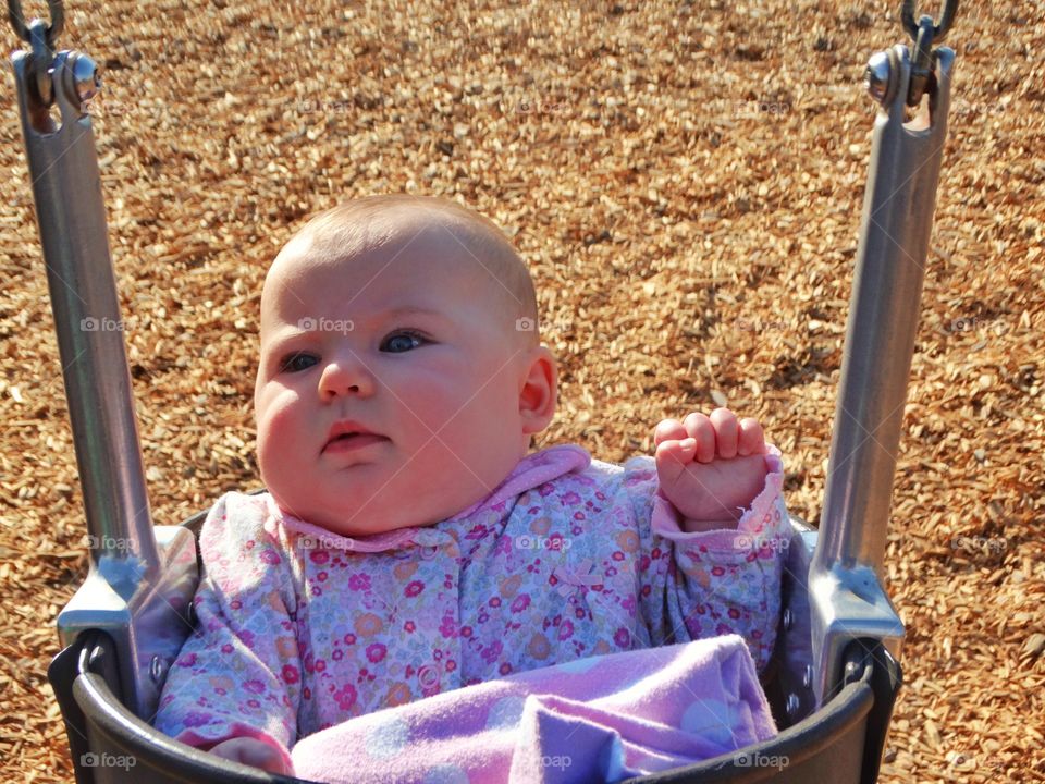 Baby On A Swingset